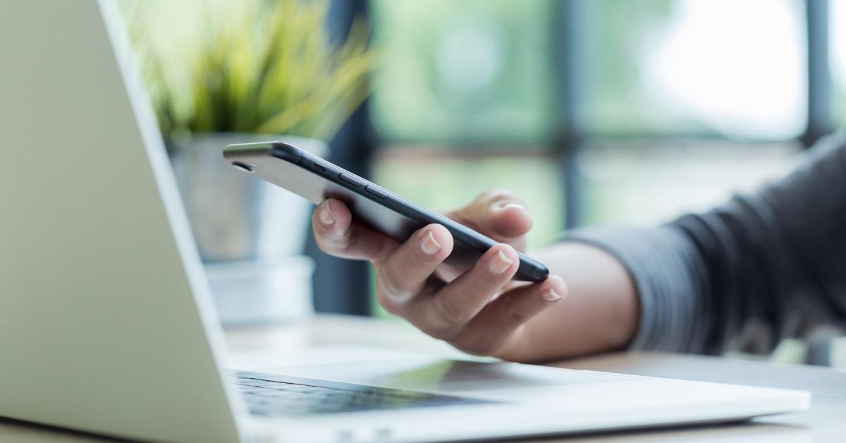 man using smartphone at work