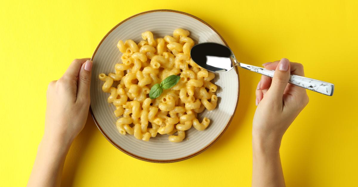 woman eating macaroni