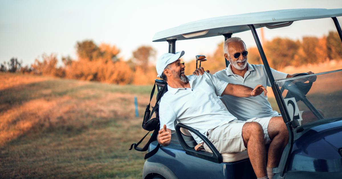 friends riding a golf cart