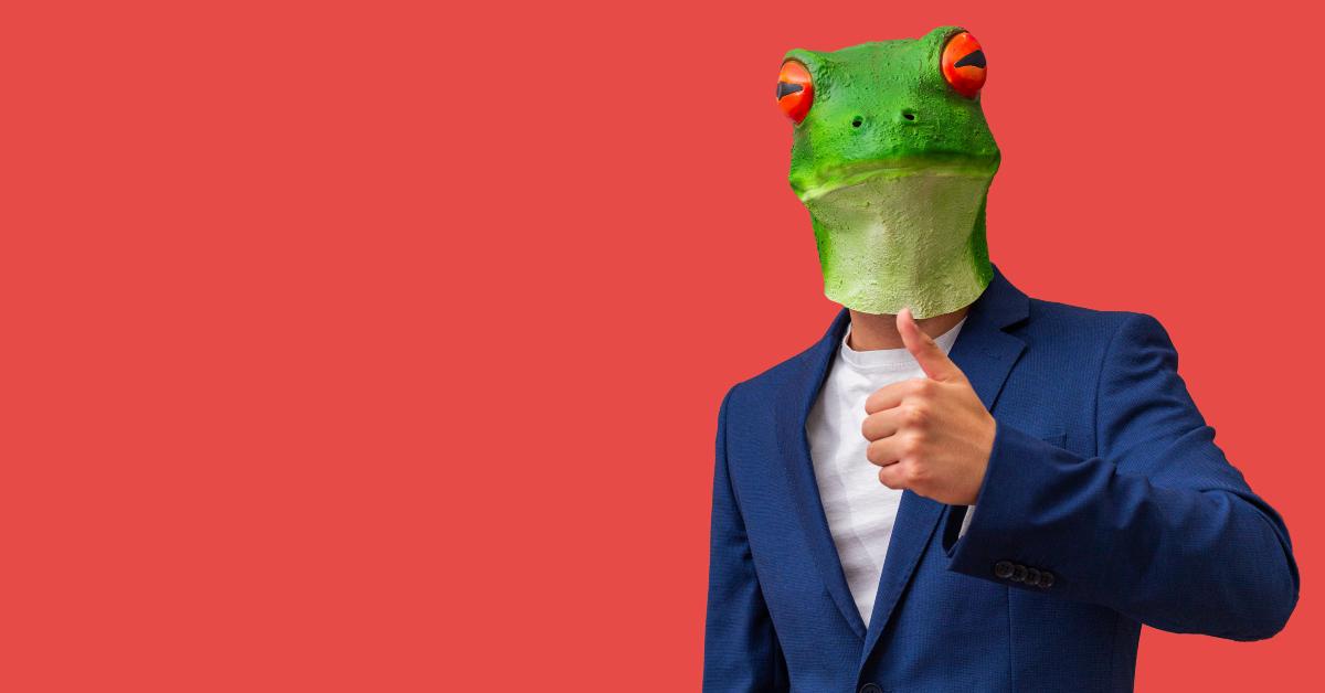 man with googly eyed frog mask