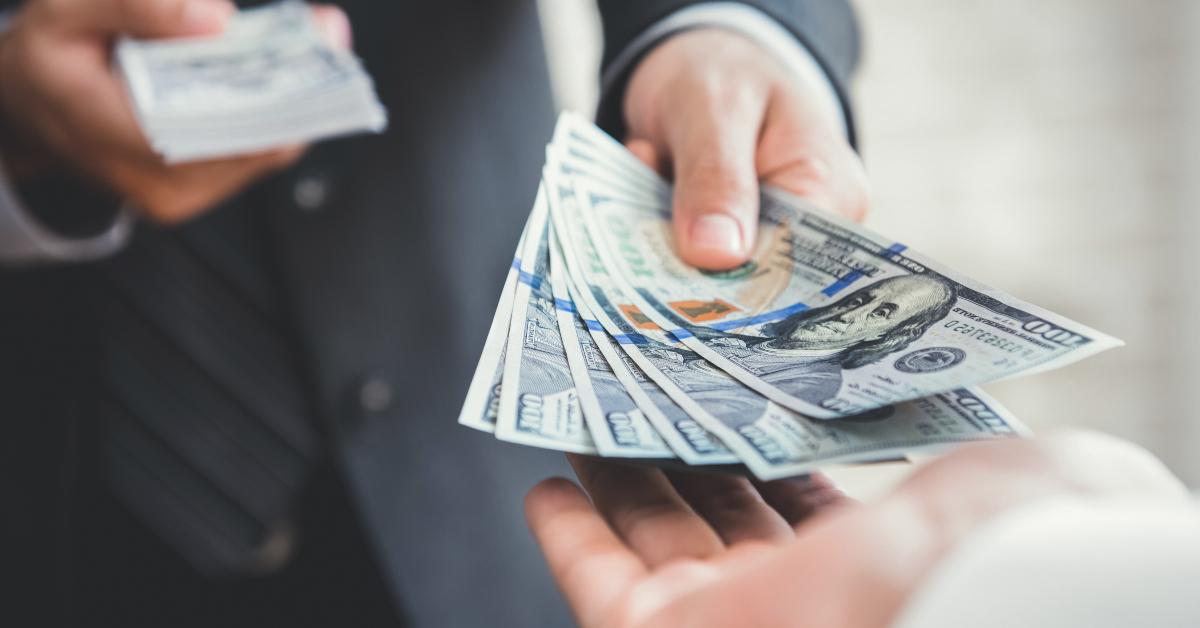 businessman paying money