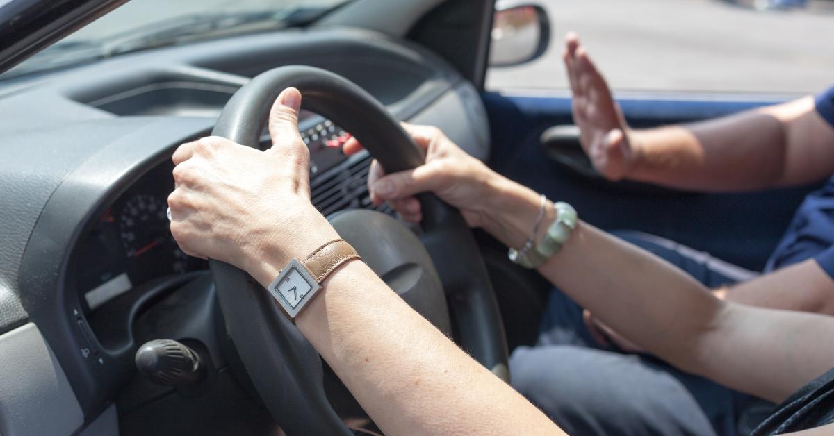 person learning to drive a car