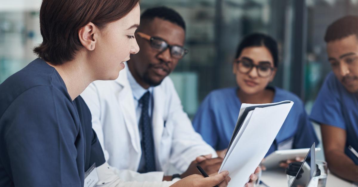 group of nurses and doctors having a meeting