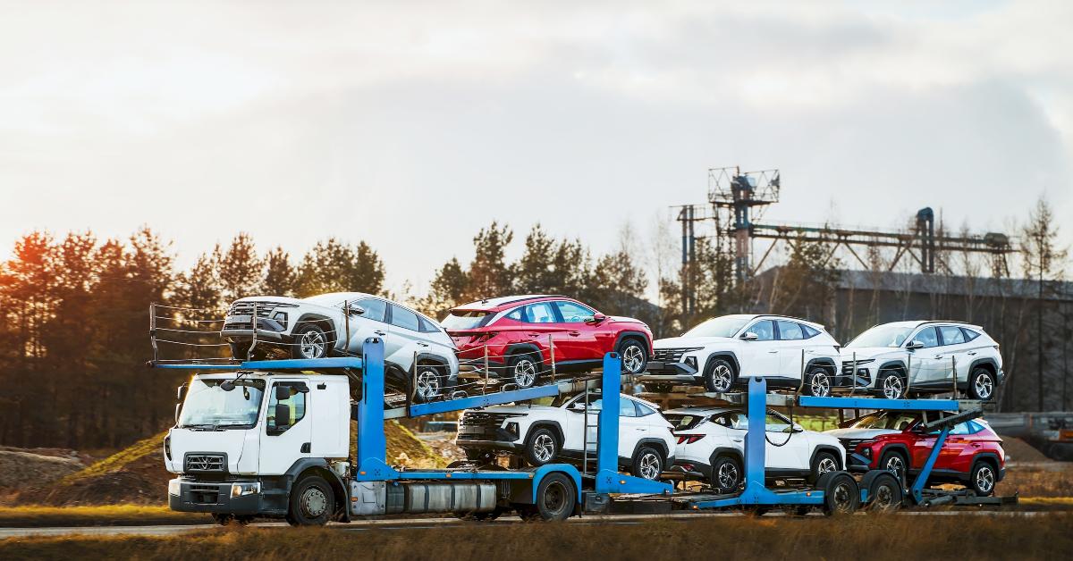 suvs on delivery transport truck 
