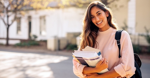 College student holding books