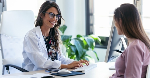 Woman talking to doctor