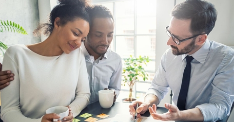 Couple discussing insurance with agent