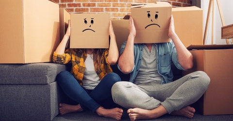 unhappy couple moving