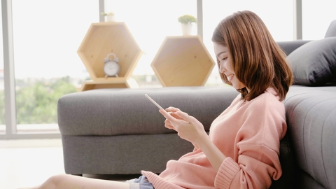 Woman watching videos on phone