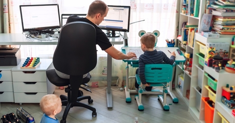 father working from home with kids