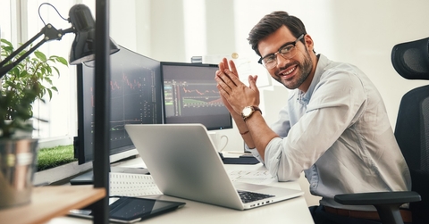 Investor looking at computers