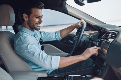 Young man driving car