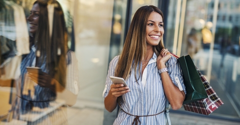 Woman shopping with phone in hand