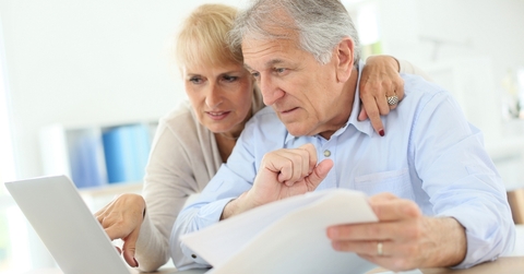 Older couple working on taxes on their computer