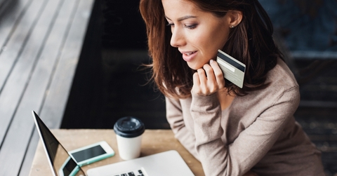 Woman shopping on a computer with a credit card