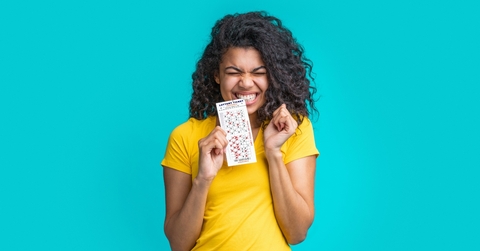woman with lottery ticket