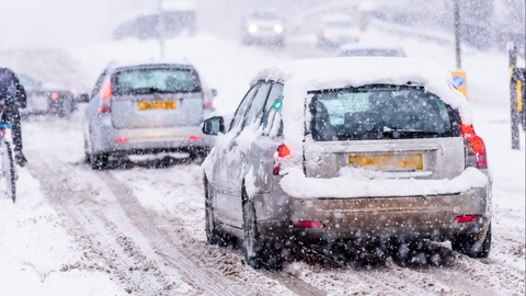 Cars driving in a snowstorm