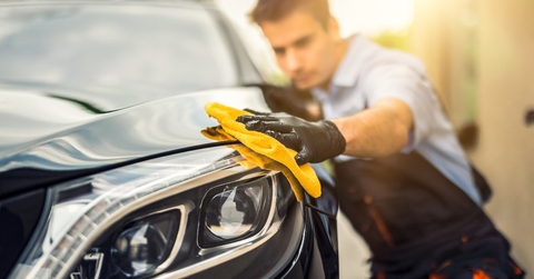 Man detailing car