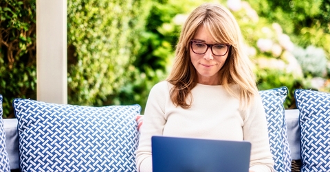 Woman outside with laptop