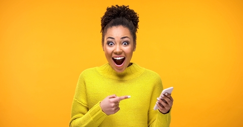Happy African American woman with phone