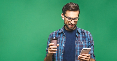 happy man holding cellphone