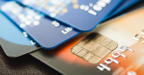 A stack of multicolored credit cards.