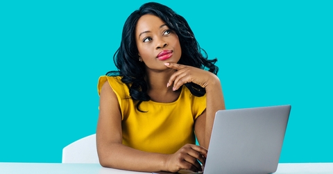 Woman working on computer and thinking