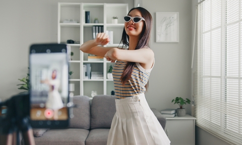 Woman dancing for a video