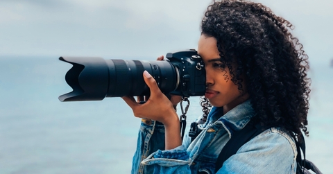 Woman taking a photograph