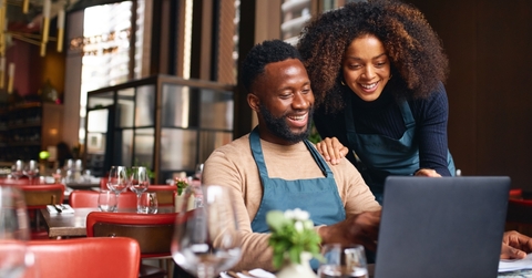 Couple running a business and researching business credit cards and lines of credit