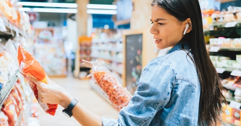 woman shopping for snacks at store