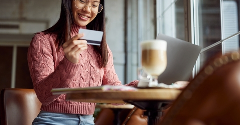 Woman using a debit card