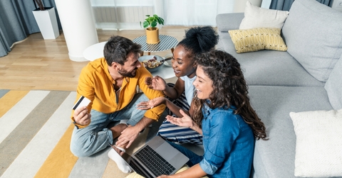 Three people considering credit card options