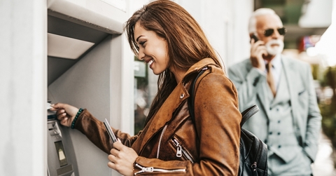 Woman taking money out of an ATM