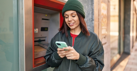 A woman using an ATM