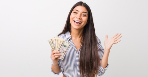A happy woman after earning a banking bonus