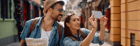 tourist couple taking photo