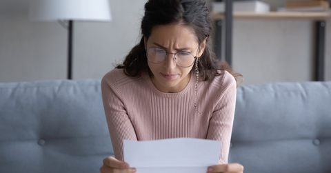 woman in glasses frustrated and confused
