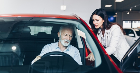 senior man choosing a new car