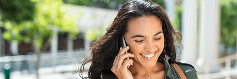 Smiling woman talking on phone