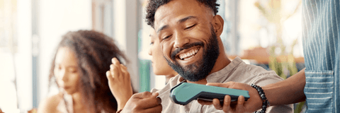 person paying with credit card