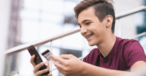 Teen boy with credit card