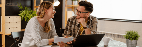 Couple doing finances on laptop
