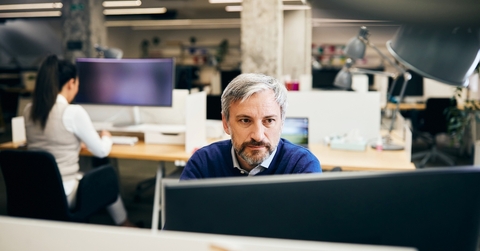 Man working on a computer at the office 