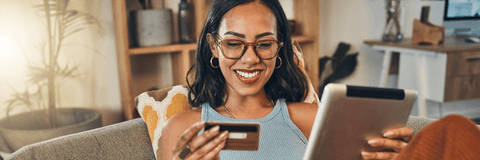 Woman on tablet with credit card