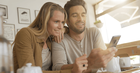 Couple on cell phone in coffee shop
