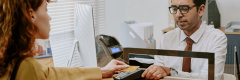 Bank teller helping customer