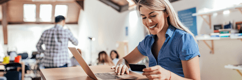 Woman on laptop with credit card