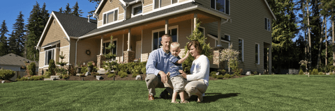 Family in front of new home