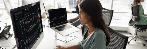 Woman checking stocks on computer